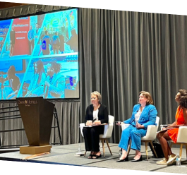 Mary German, Lisa Waldschmitt, Roz Stuttley on sitting in soft seating on stage for a panel at Destination's International Annual Conference 